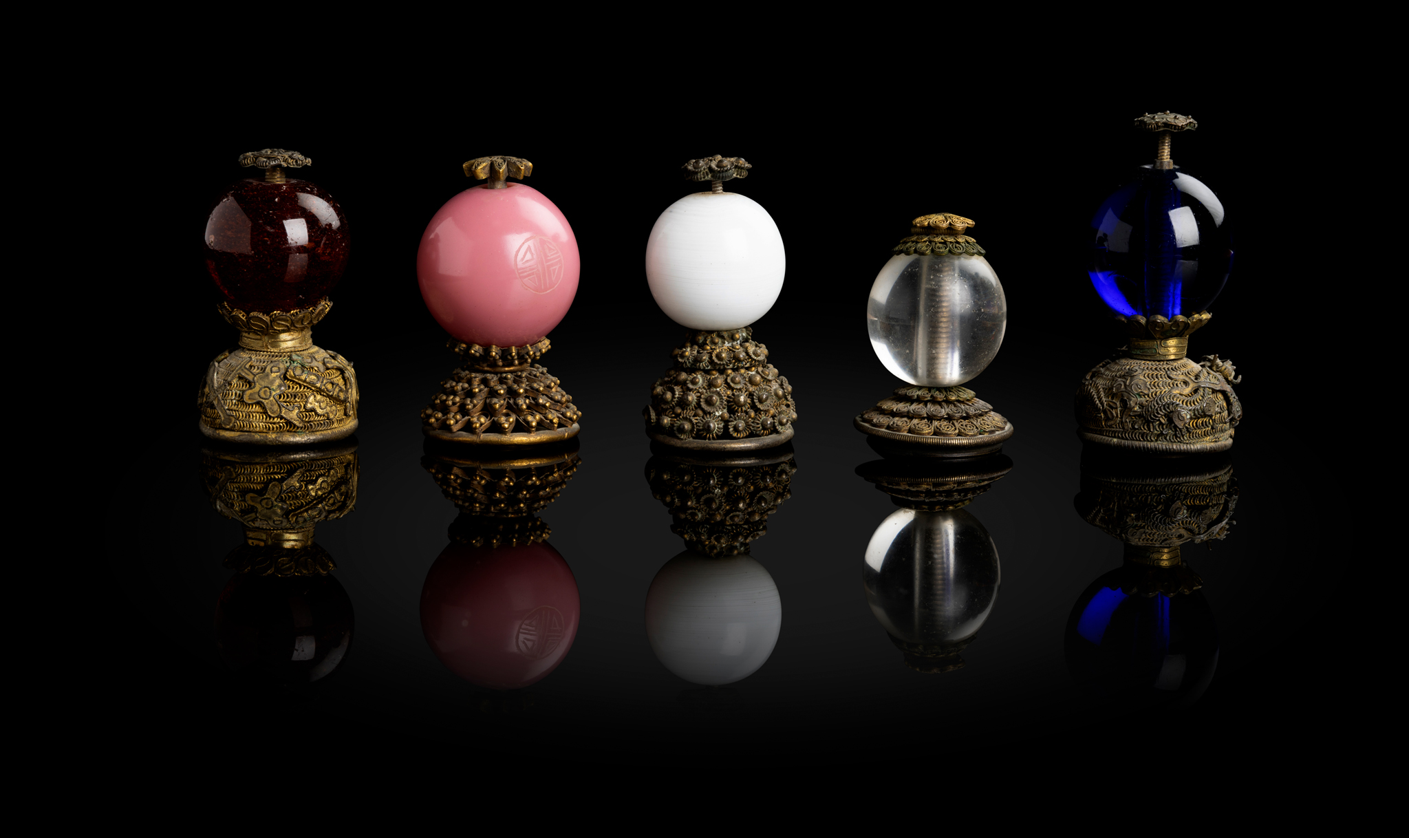 GROUP OF FIVE GLASS AND GILT BRONZE "OFFICIAL'S HAT" FINIALS