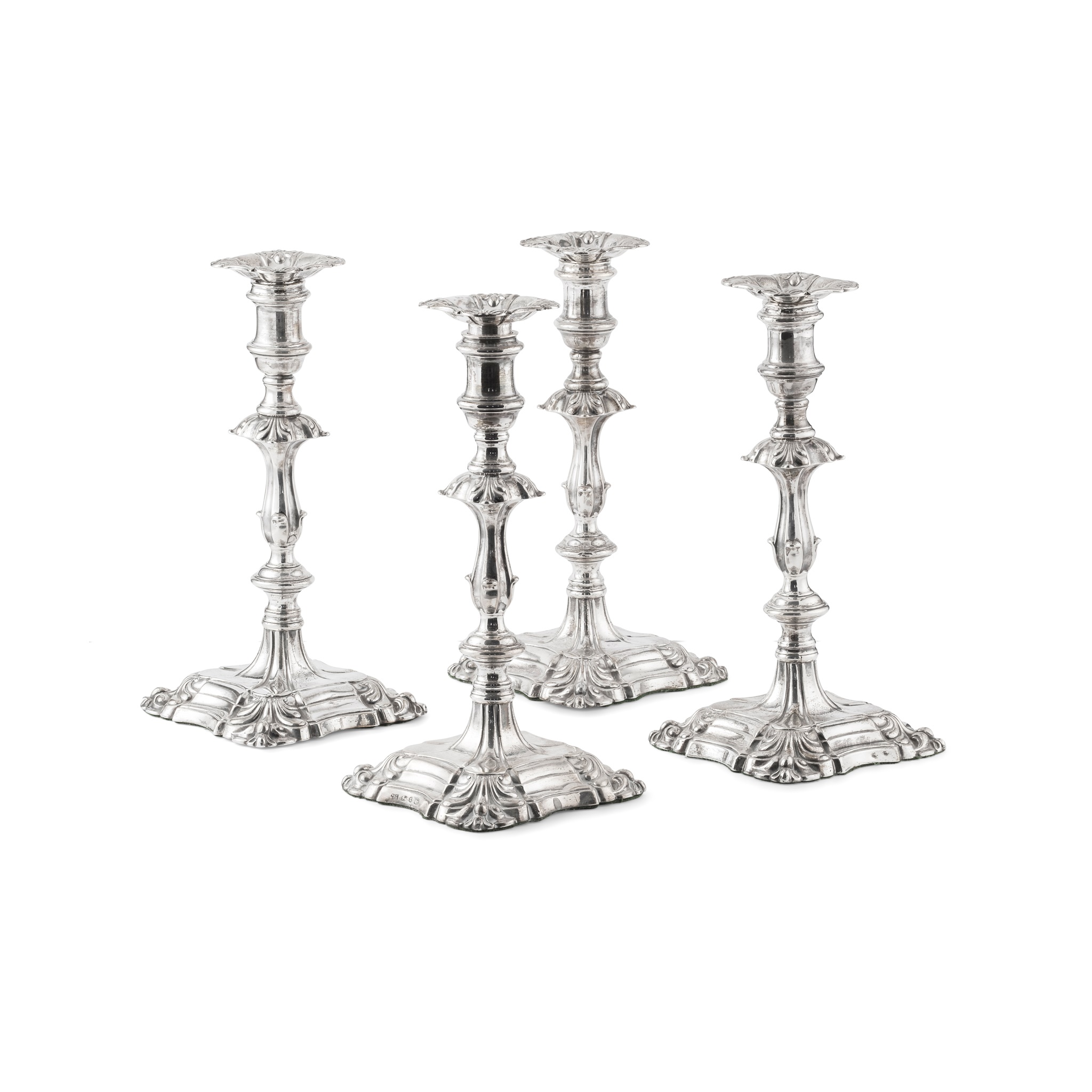 A set four William IV table candlesticks