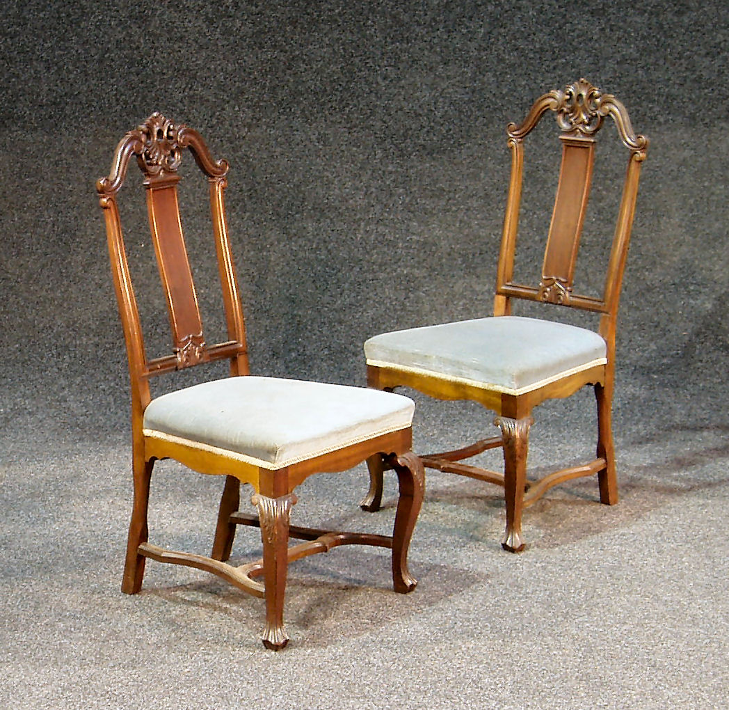 A set of four late Victorian mahogany dining chairs