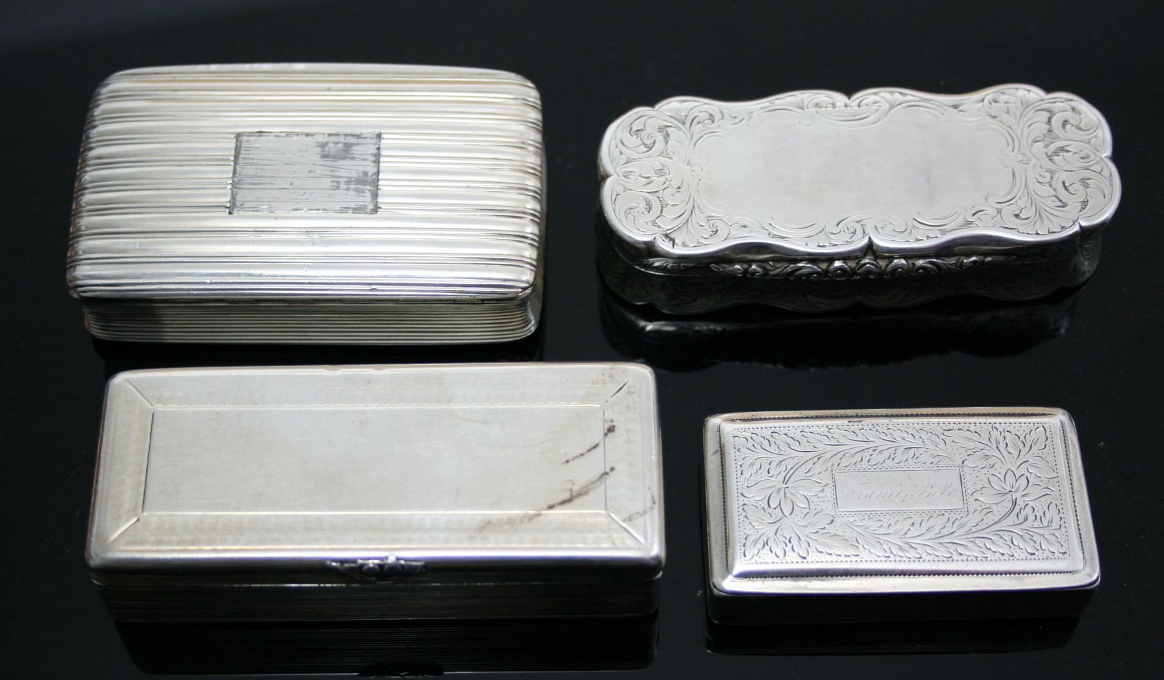 A group of four silver snuff boxes
