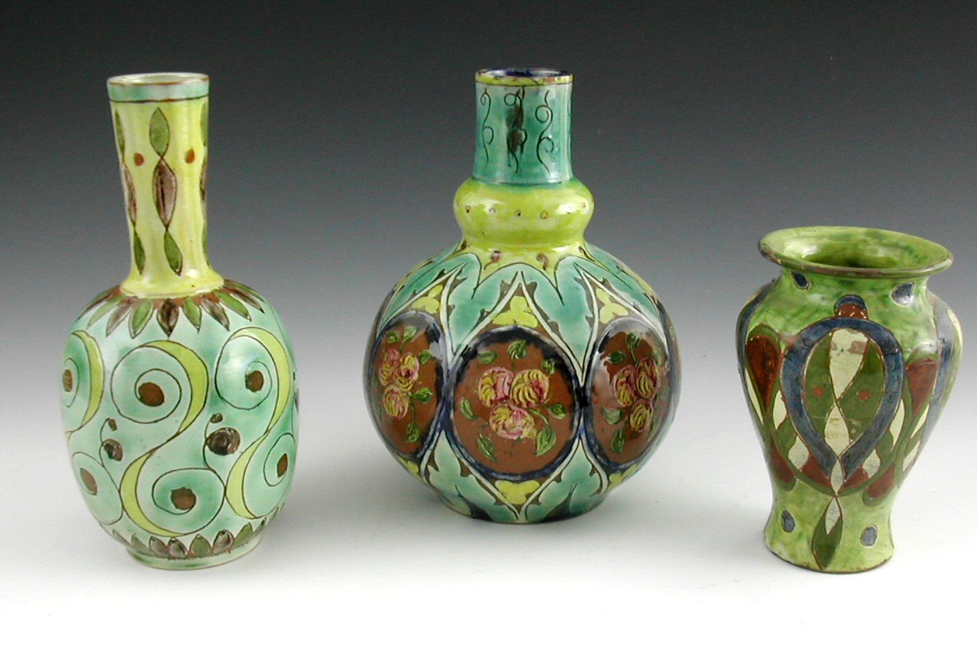 A group of three Della Robbia vases,