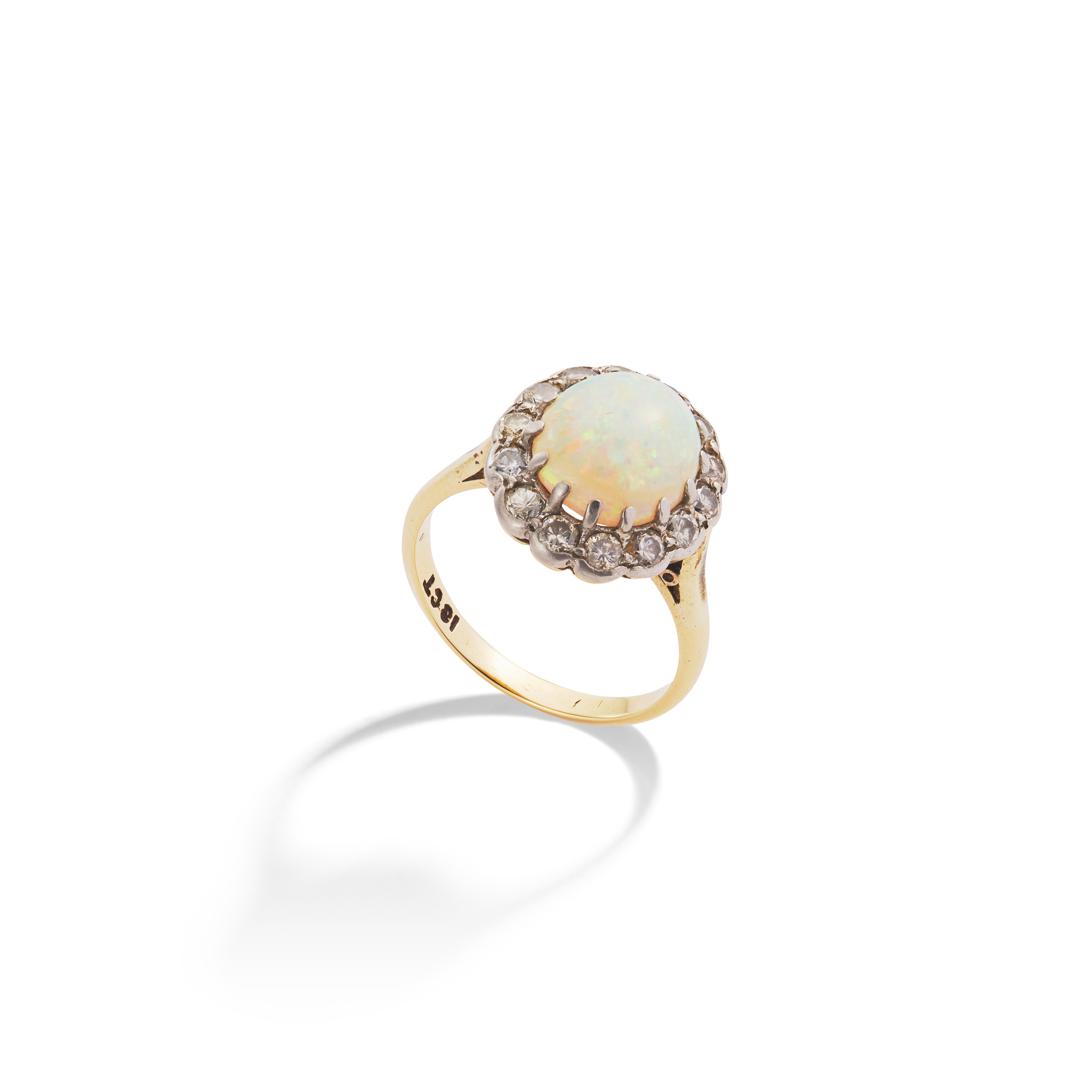 An opal and diamond cluster ring and matching earrings