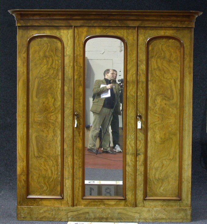 A Victorian walnut triple door wardrobe,