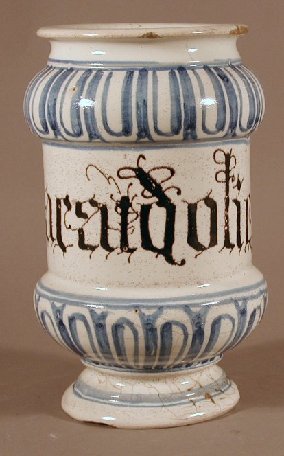 An Italian blue painted tin glazed albarello