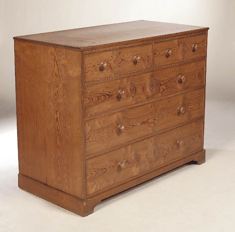 An early 19th century pitch pine chest of drawers,