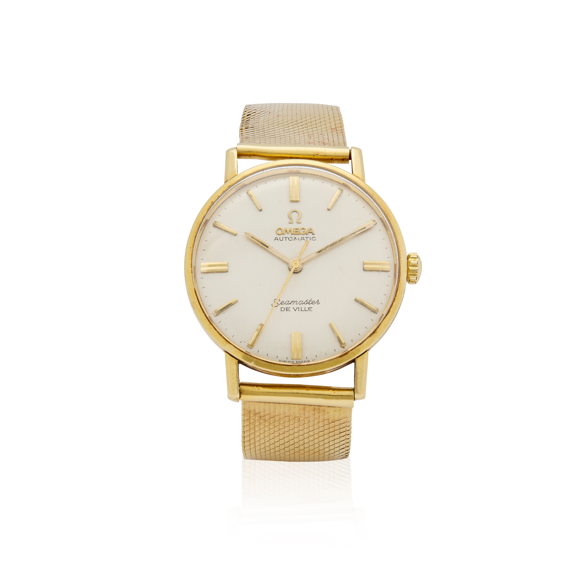 Omega. An 18k gold automatic wristwatch on associated 18k gold bracelet