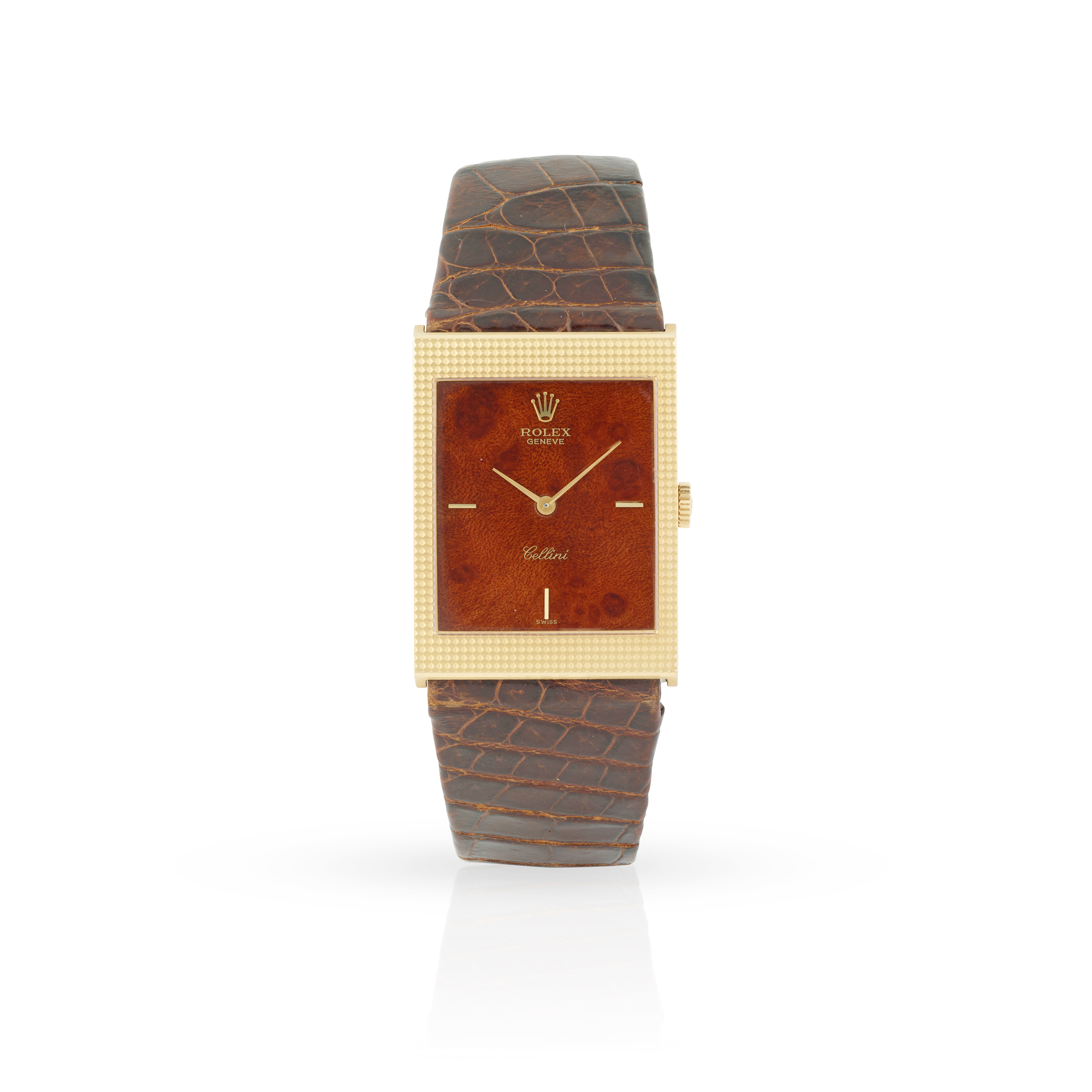 Rolex. A fine and well-preserved 18k yellow gold rectangular mechanical wristwatch with burlwood dial,