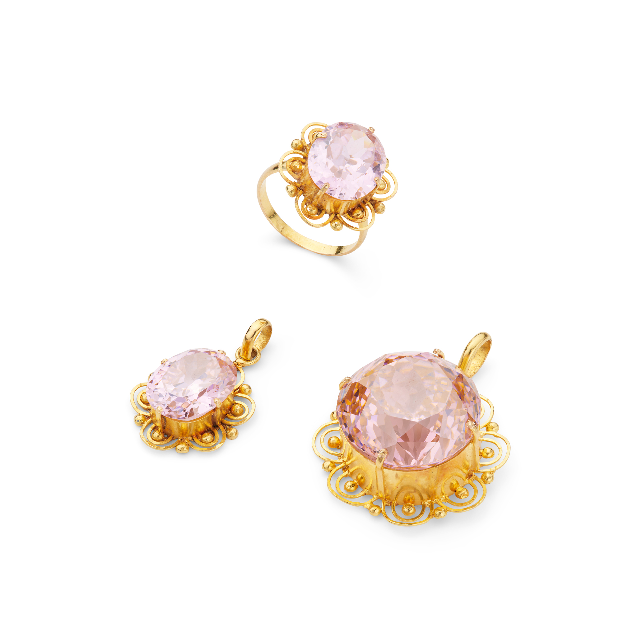 A pink cubic zirconia ring and matching pendants