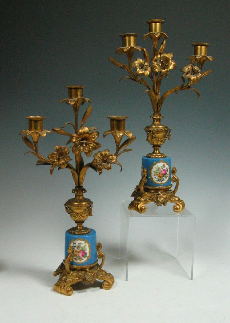 A pair of Sevres style giltmetal candelabra