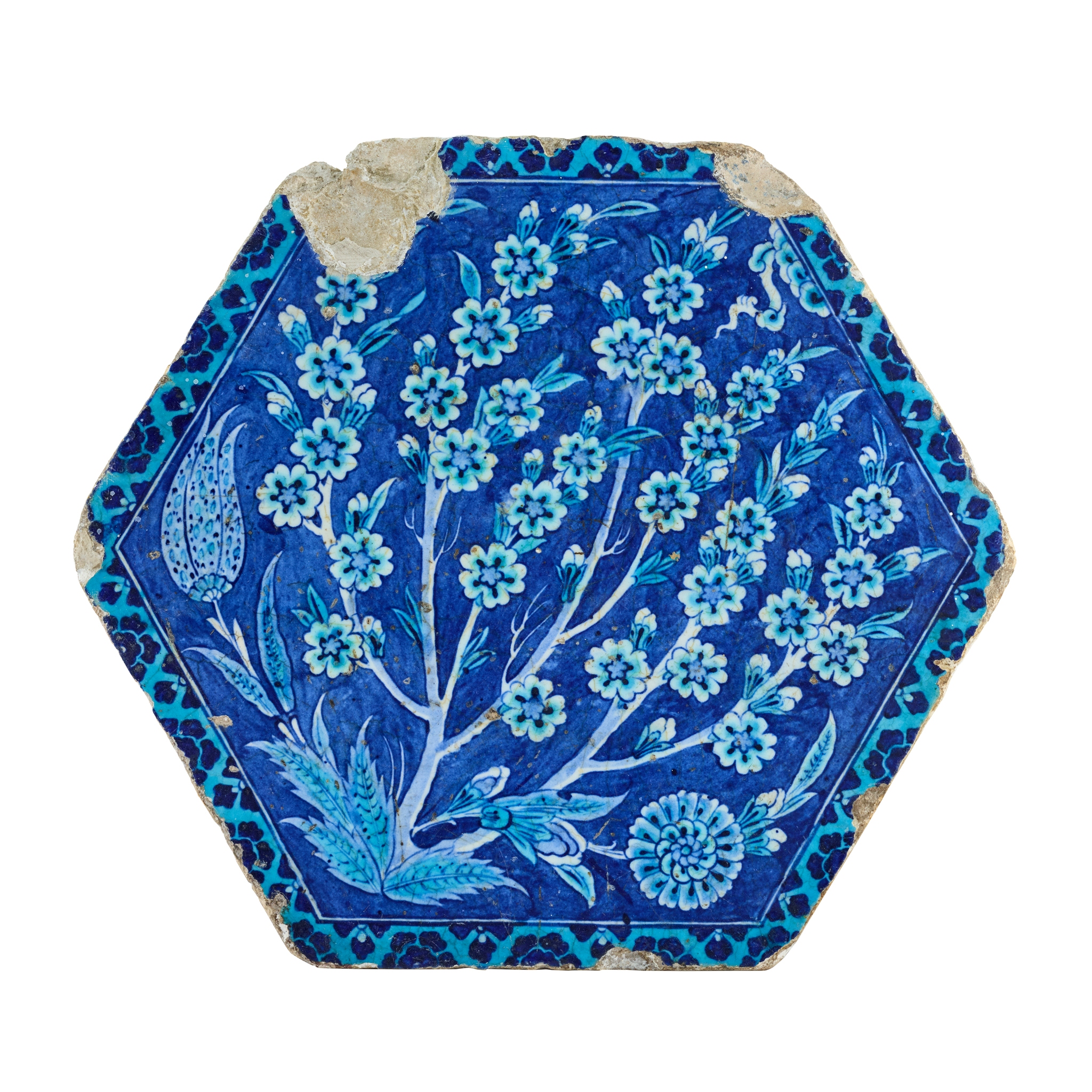 AN EXTREMELY RARE IZNIK POTTERY TILE FROM THE CINILI HAMAM