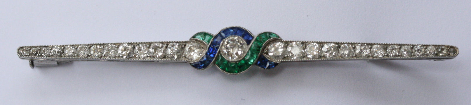 BOUCHERON - an Art Deco multi-gem set bar brooch