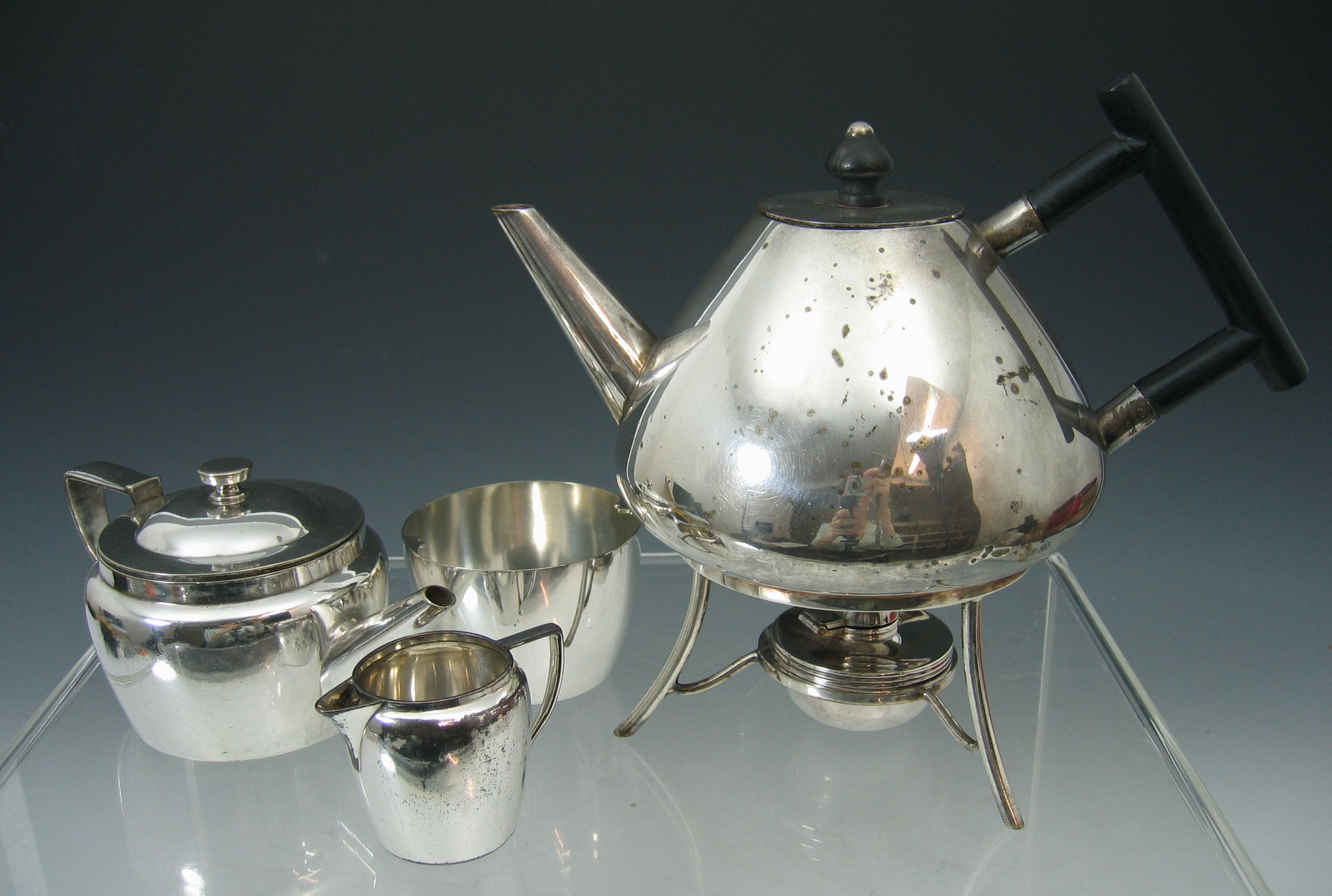 Christopher Dresser (1834-1904) A Hukin and Heath electroplated kettle on stand,