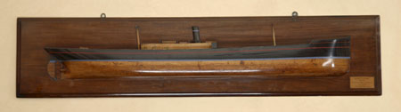 An early 20th century painted wood half model of a ship