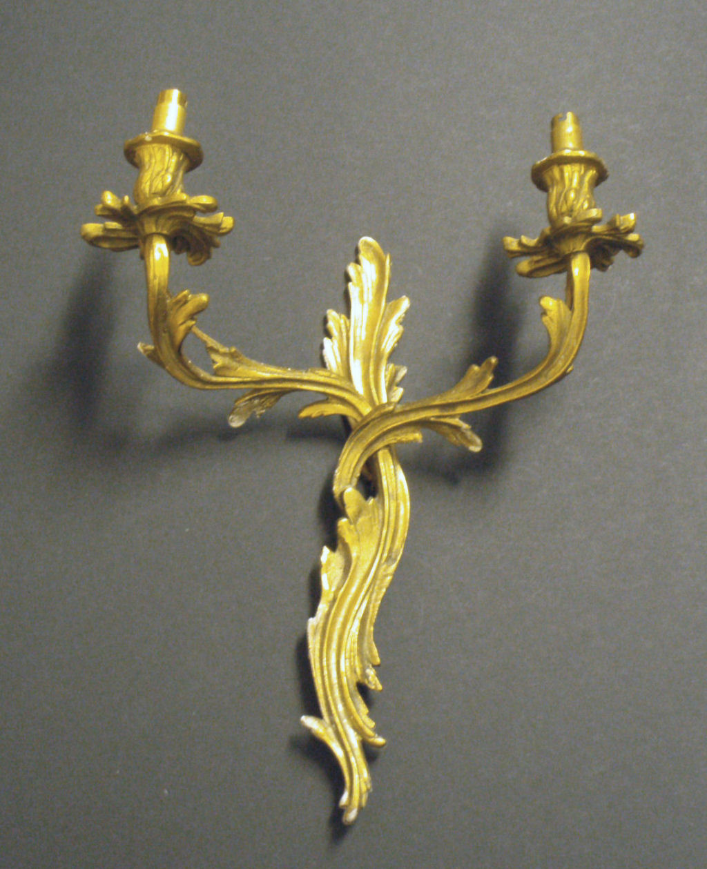 A set of four Louis XV style giltmetal wall lights