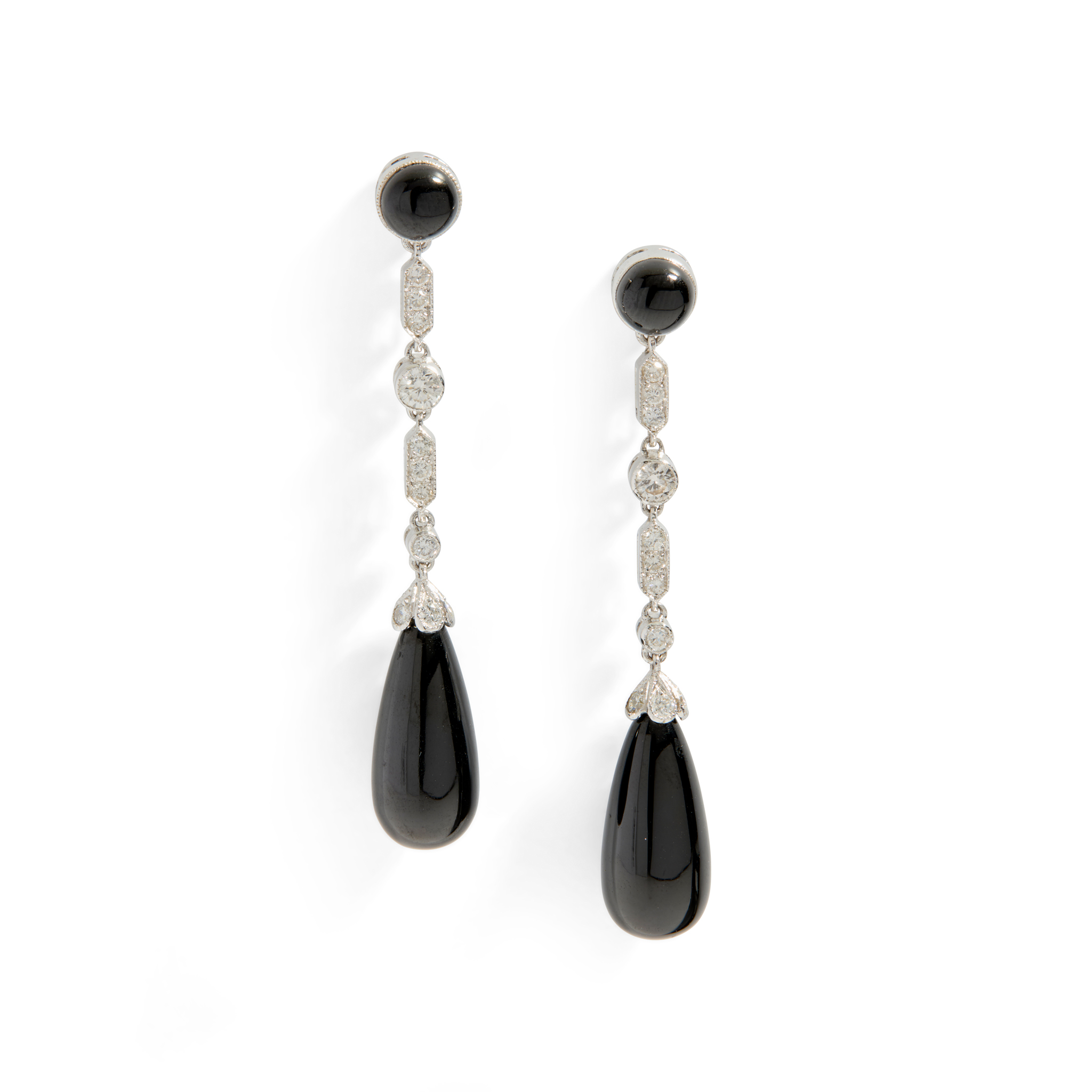A pair of onyx and diamond pendent earrings