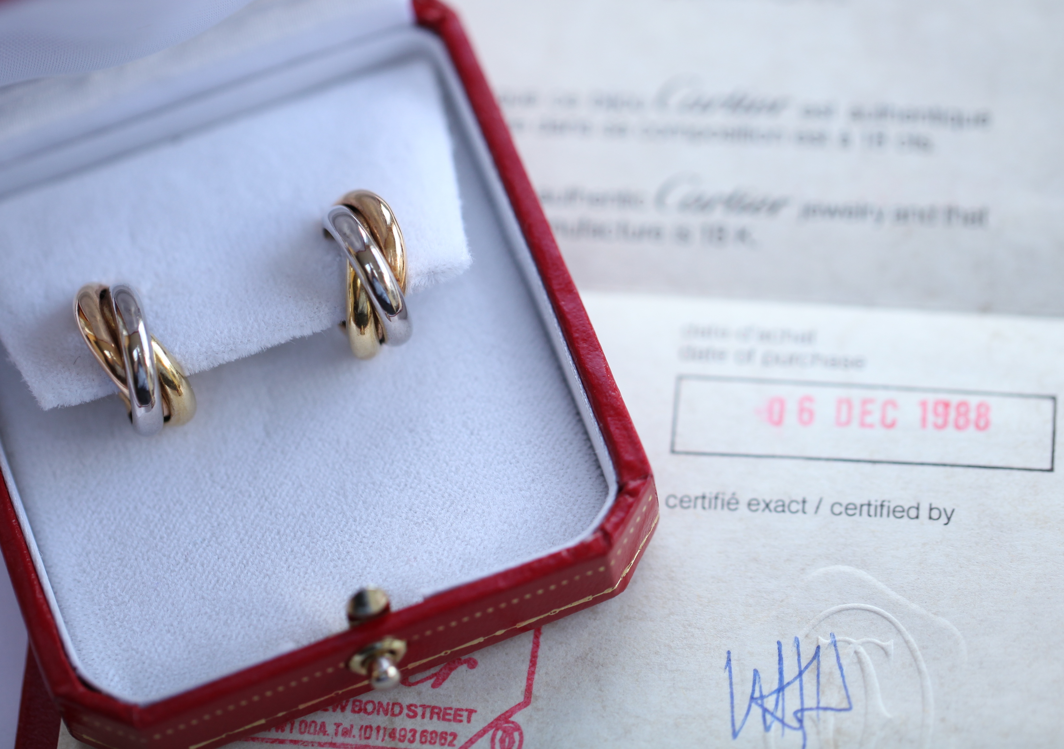 CARTIER - a pair of trinity gold earrings