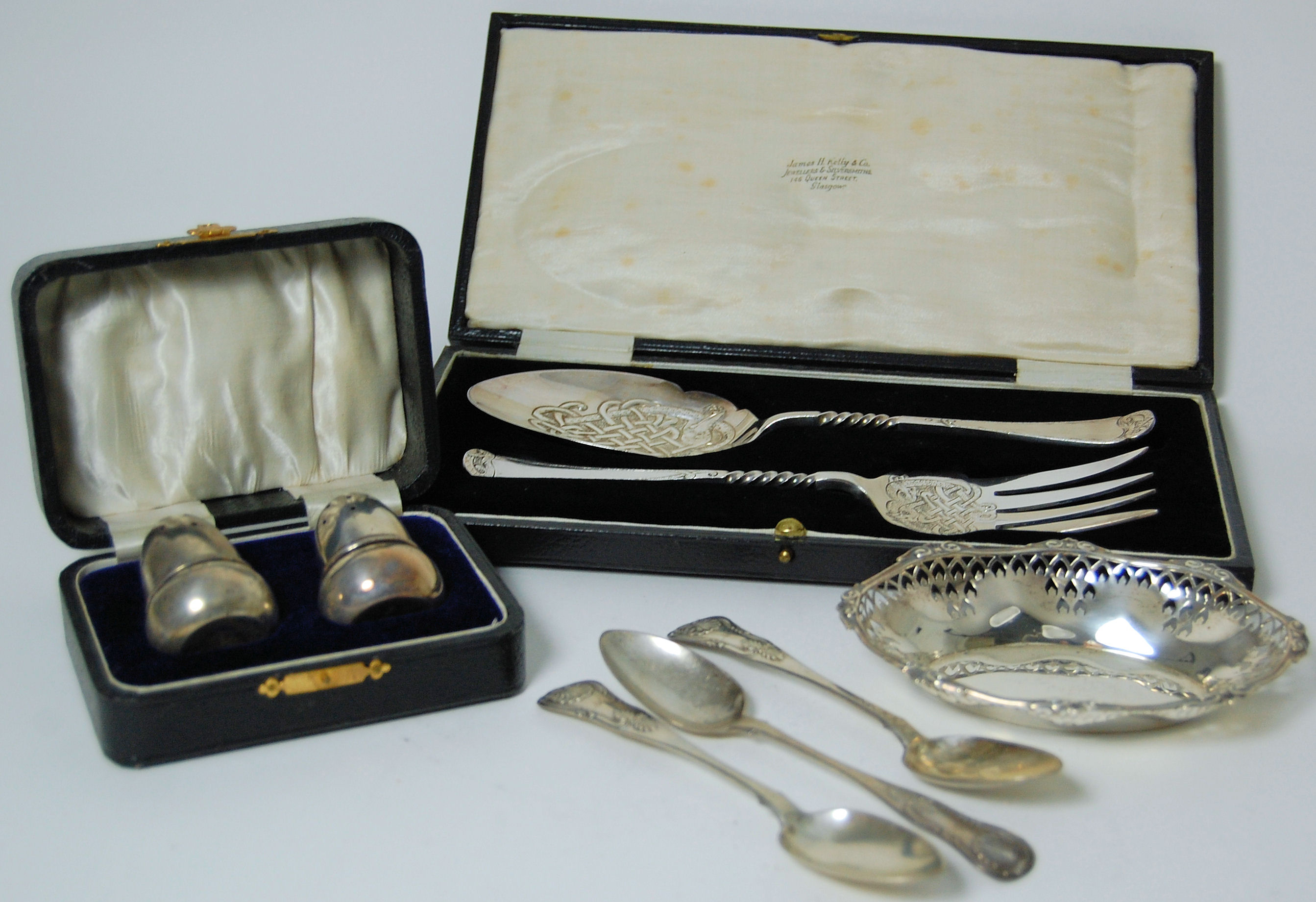 A group of cased cutlery