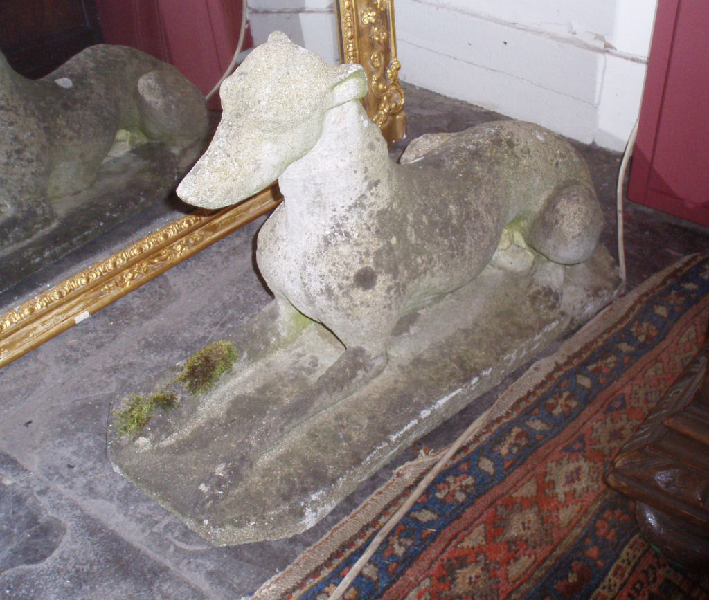 A pair of stone greyhounds