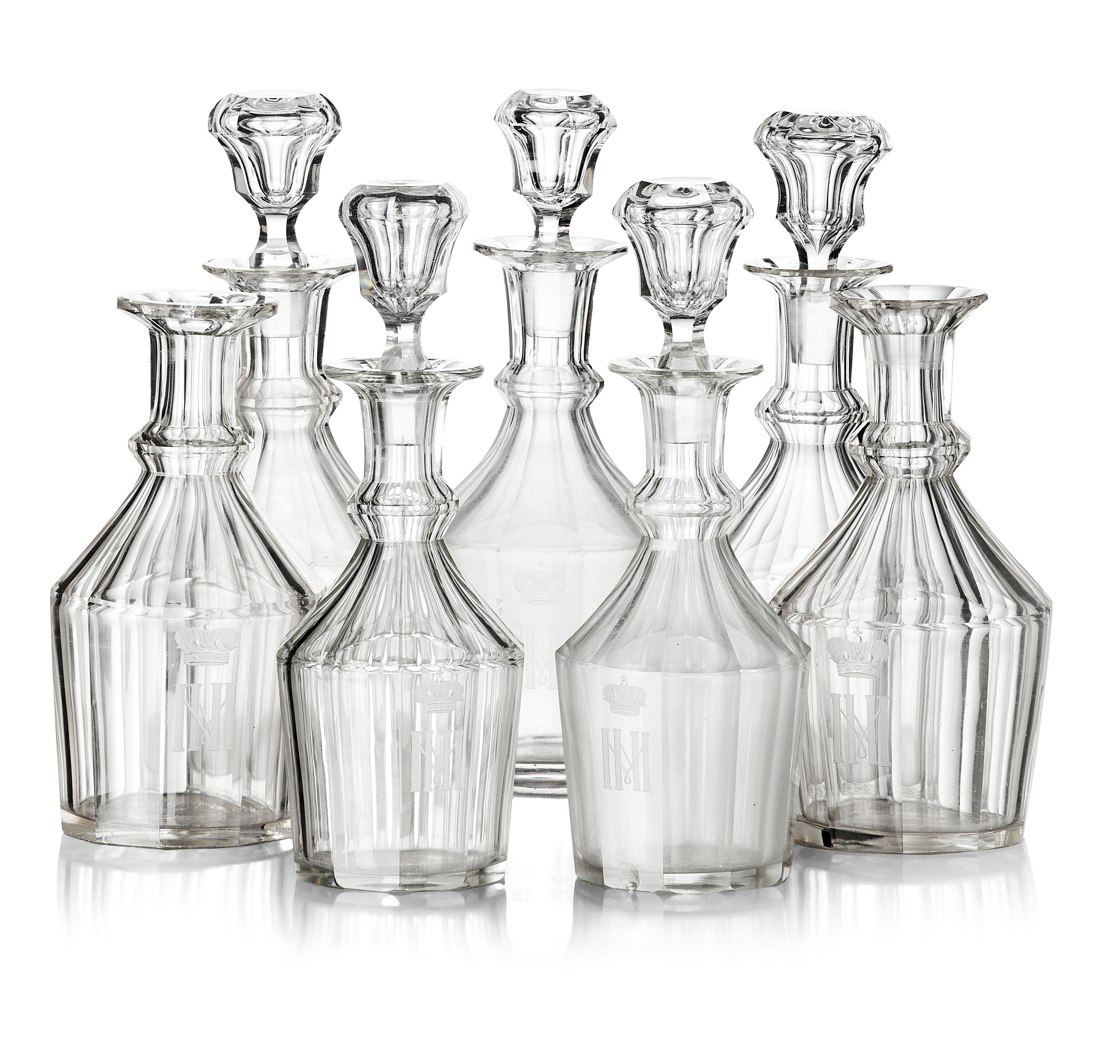 SEVEN RUSSIAN IMPERIAL GLASS WORKS DECANTERS FROM A GRAND DUKE MICHAEL NIKOLAEVICH BANQUET SERVICE