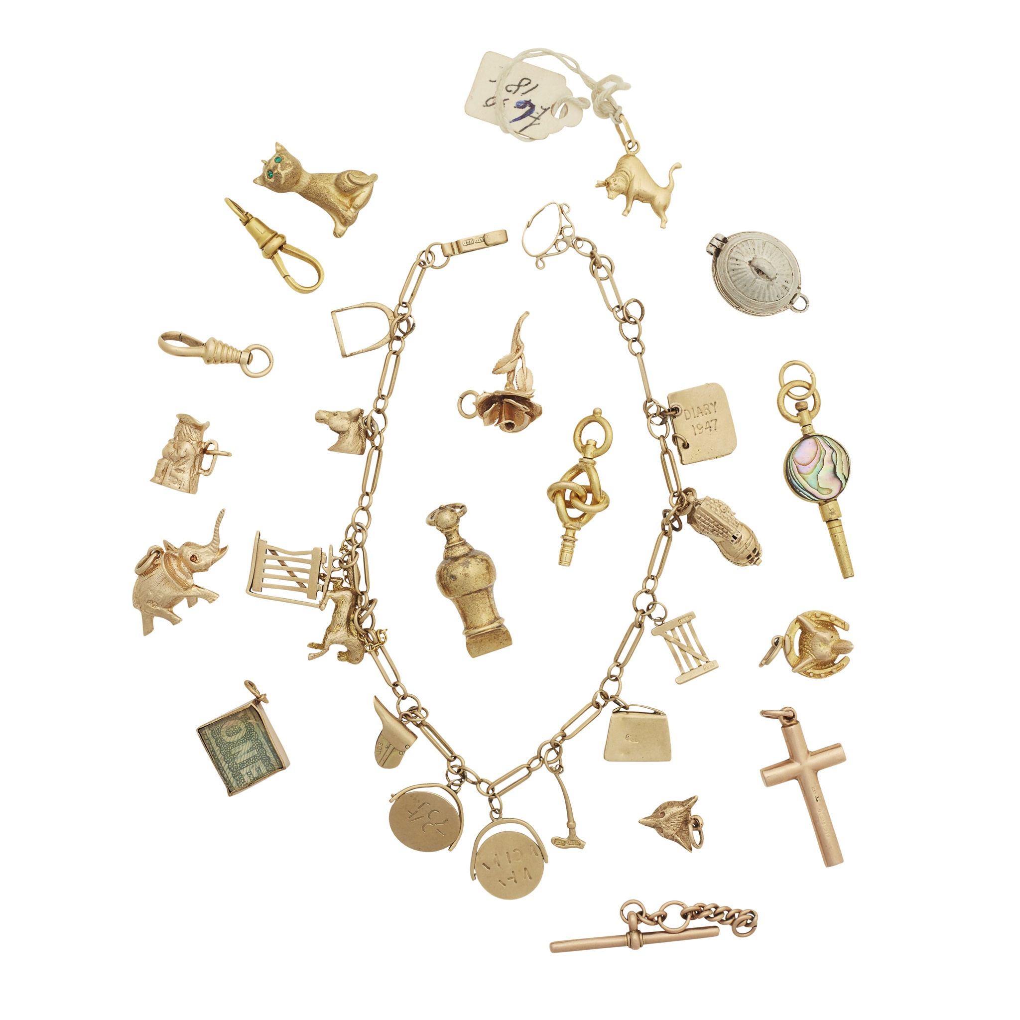 A charm bracelet and collection of loose charms
