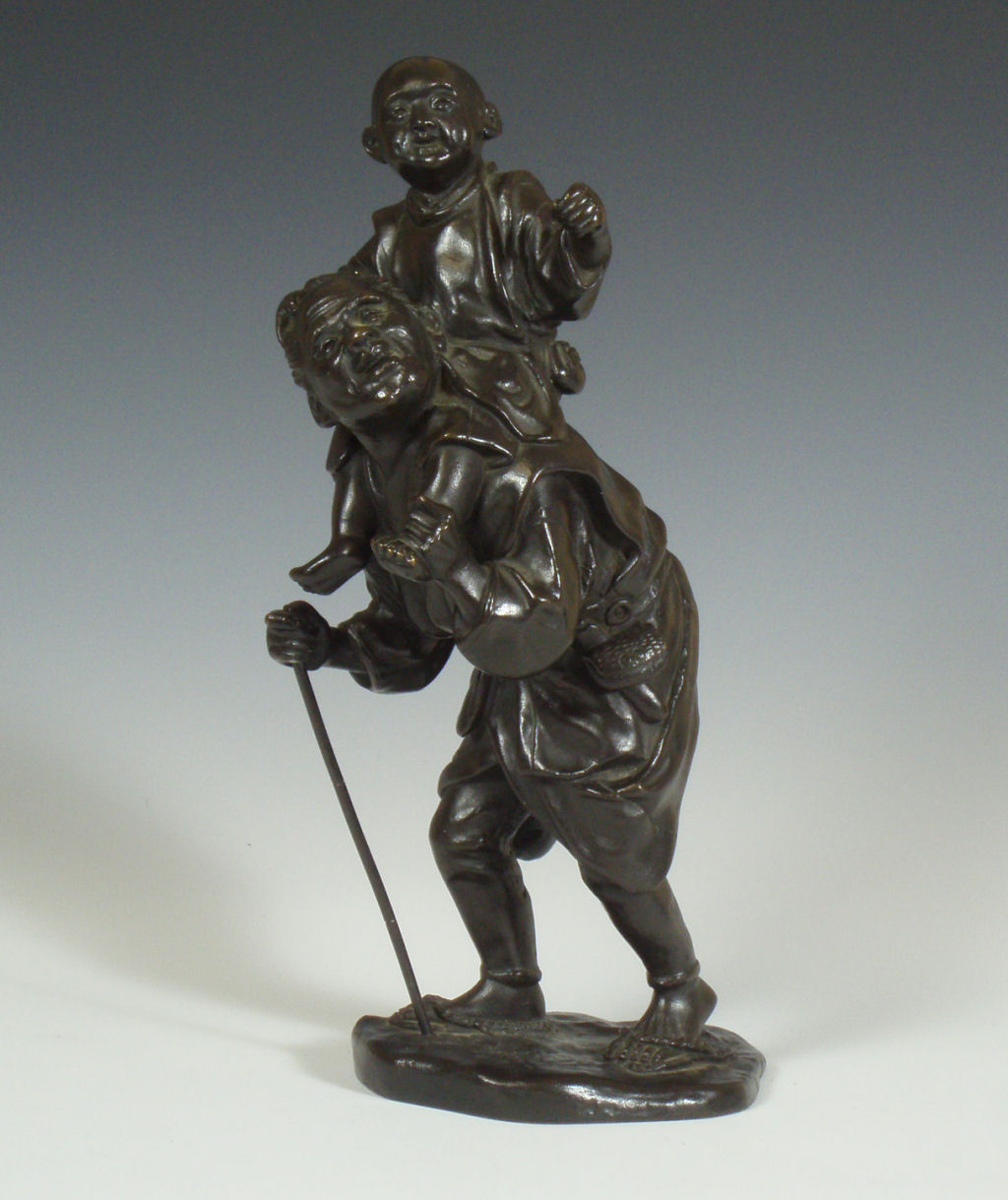 A Japanese bronze figure group, Meiji period