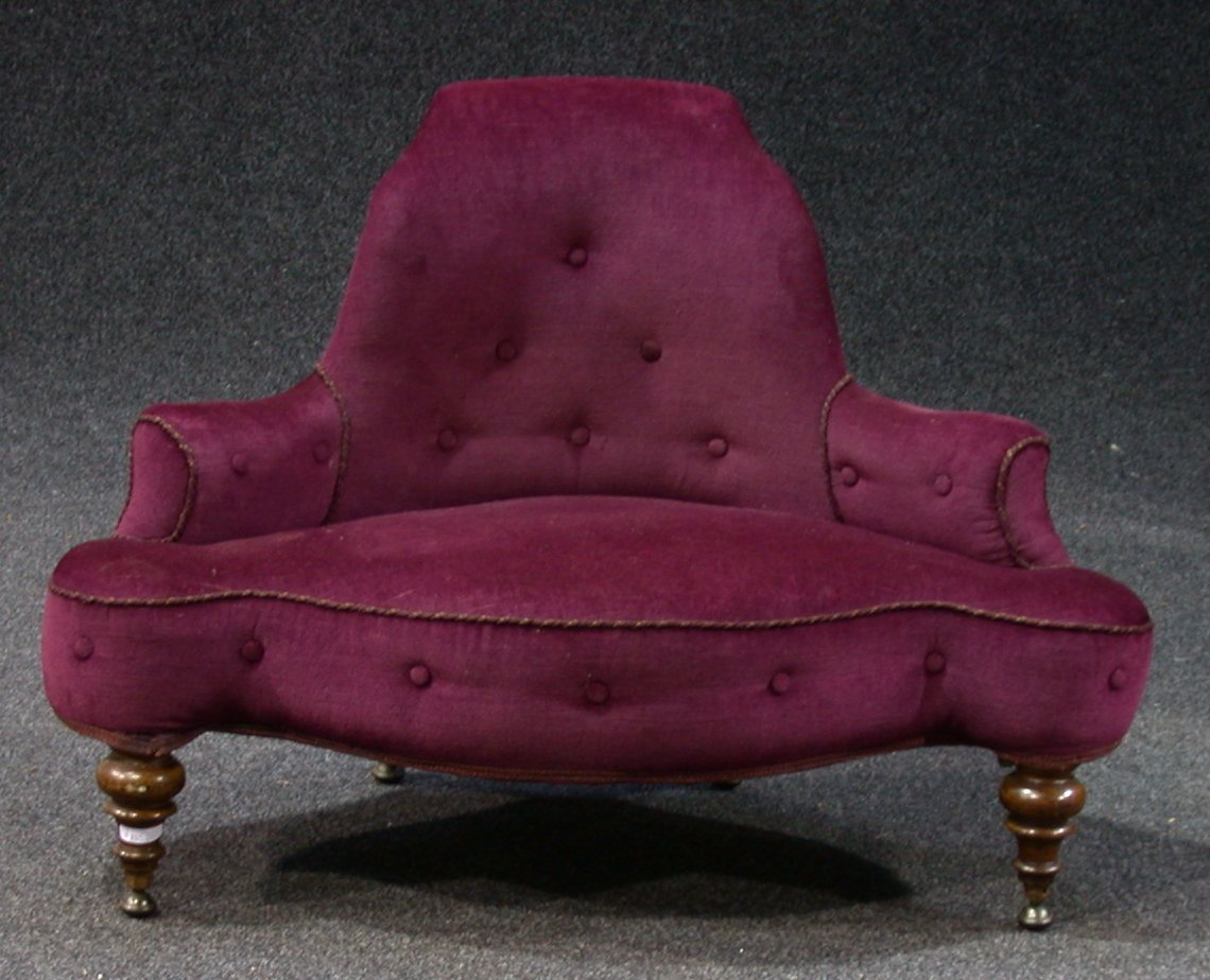 A Victorian stuffover upholstered small settee,