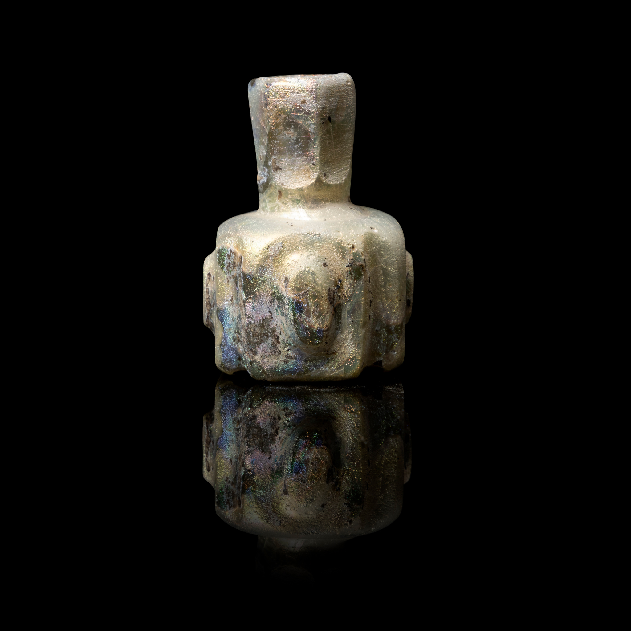 AN EARLY ISLAMIC MINIATURE GLASS PERFUME BOTTLE