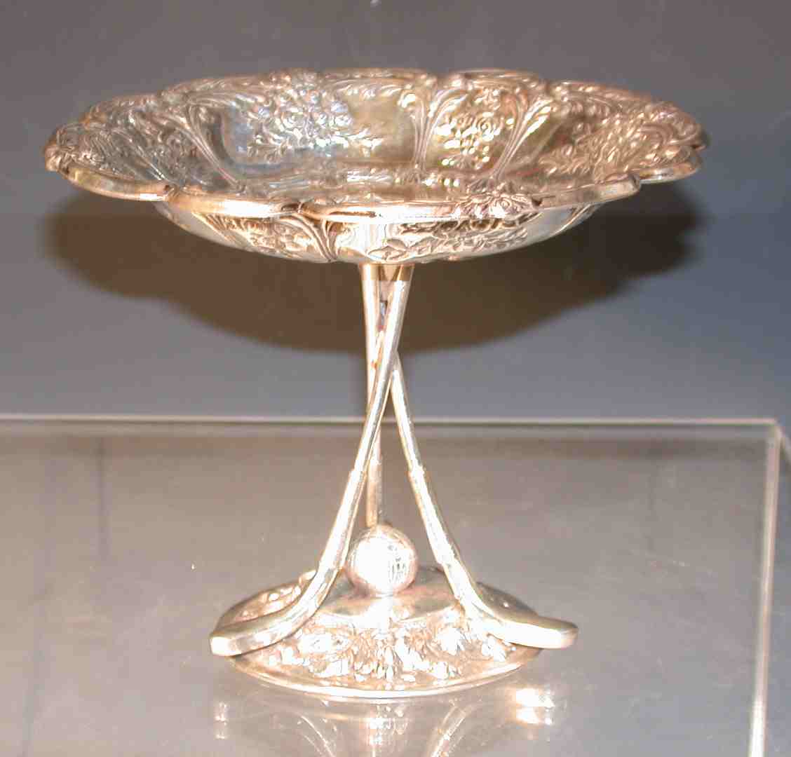 A silver plated golfing comport,