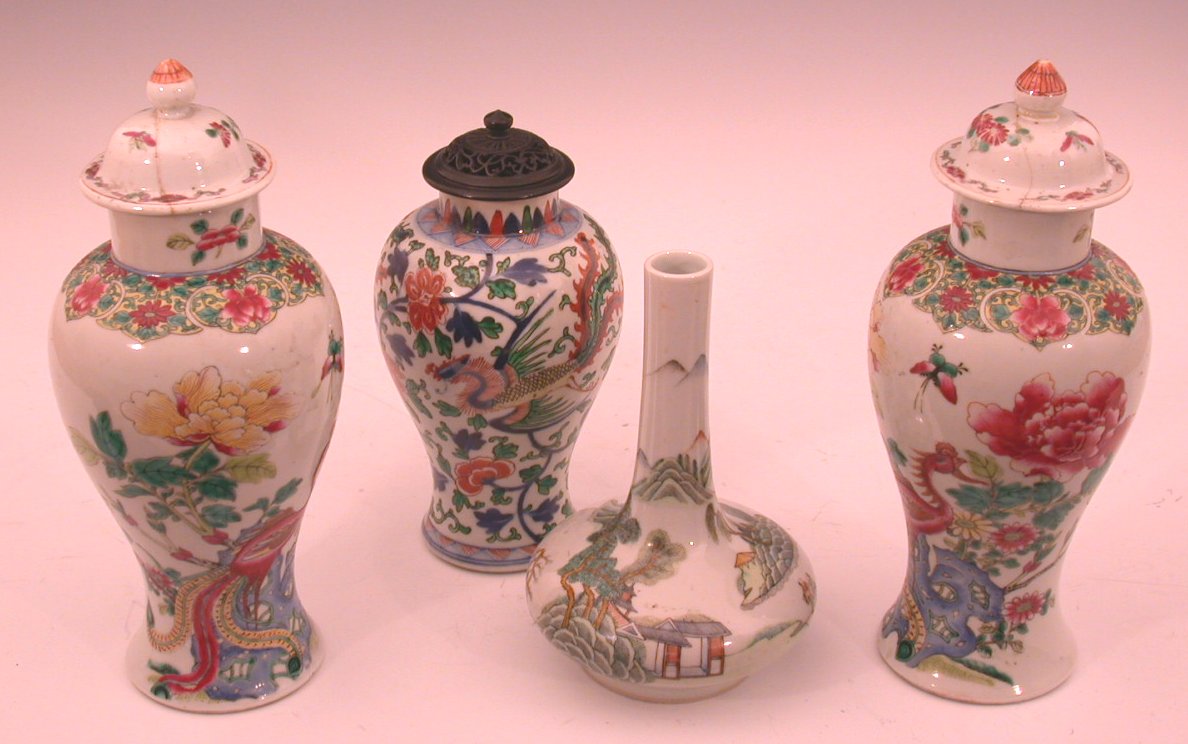 A pair of Chinese famille rose baluster vases and covers,