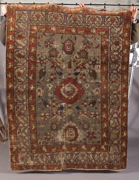An antique silk Heriz rug