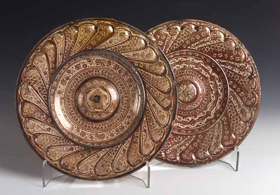 A matched pair of 17th century Hispano-Moresque circular chargers