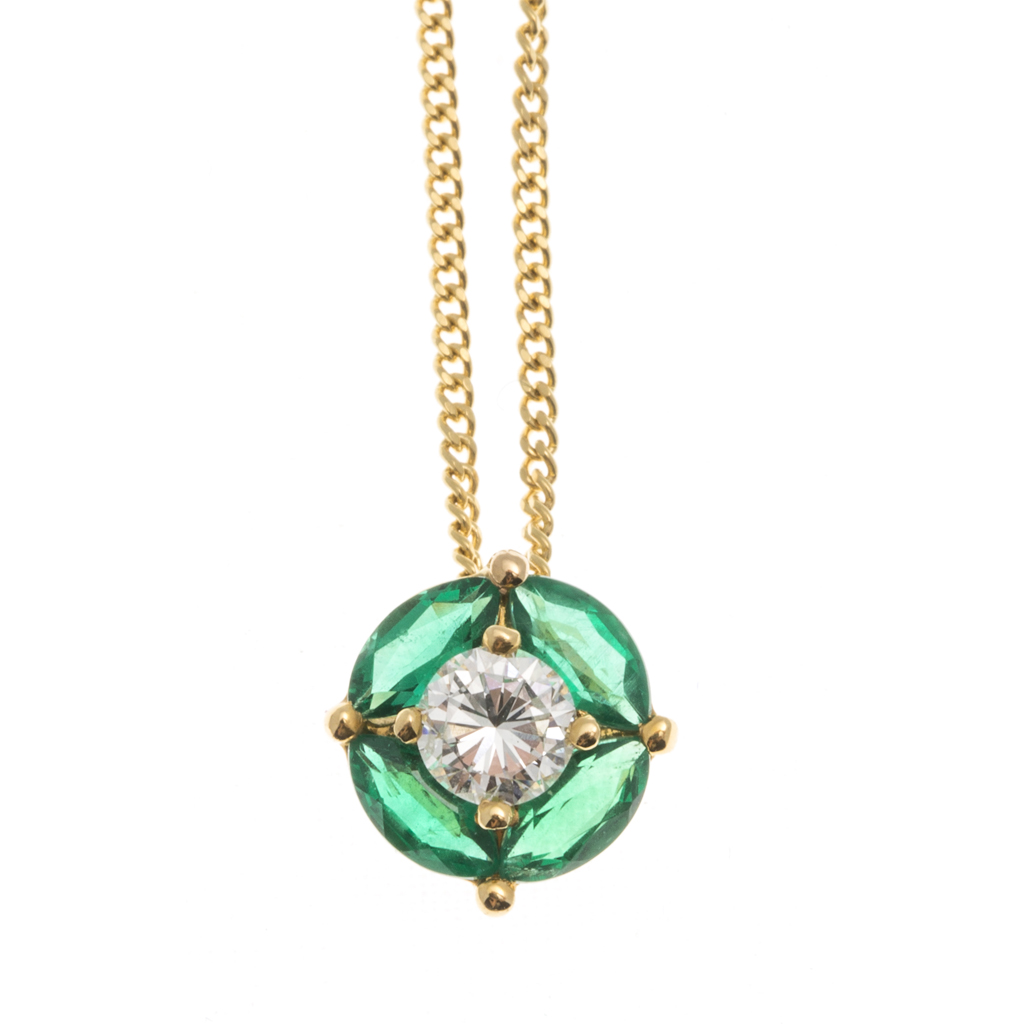 An 18ct gold emerald and diamond set pendant