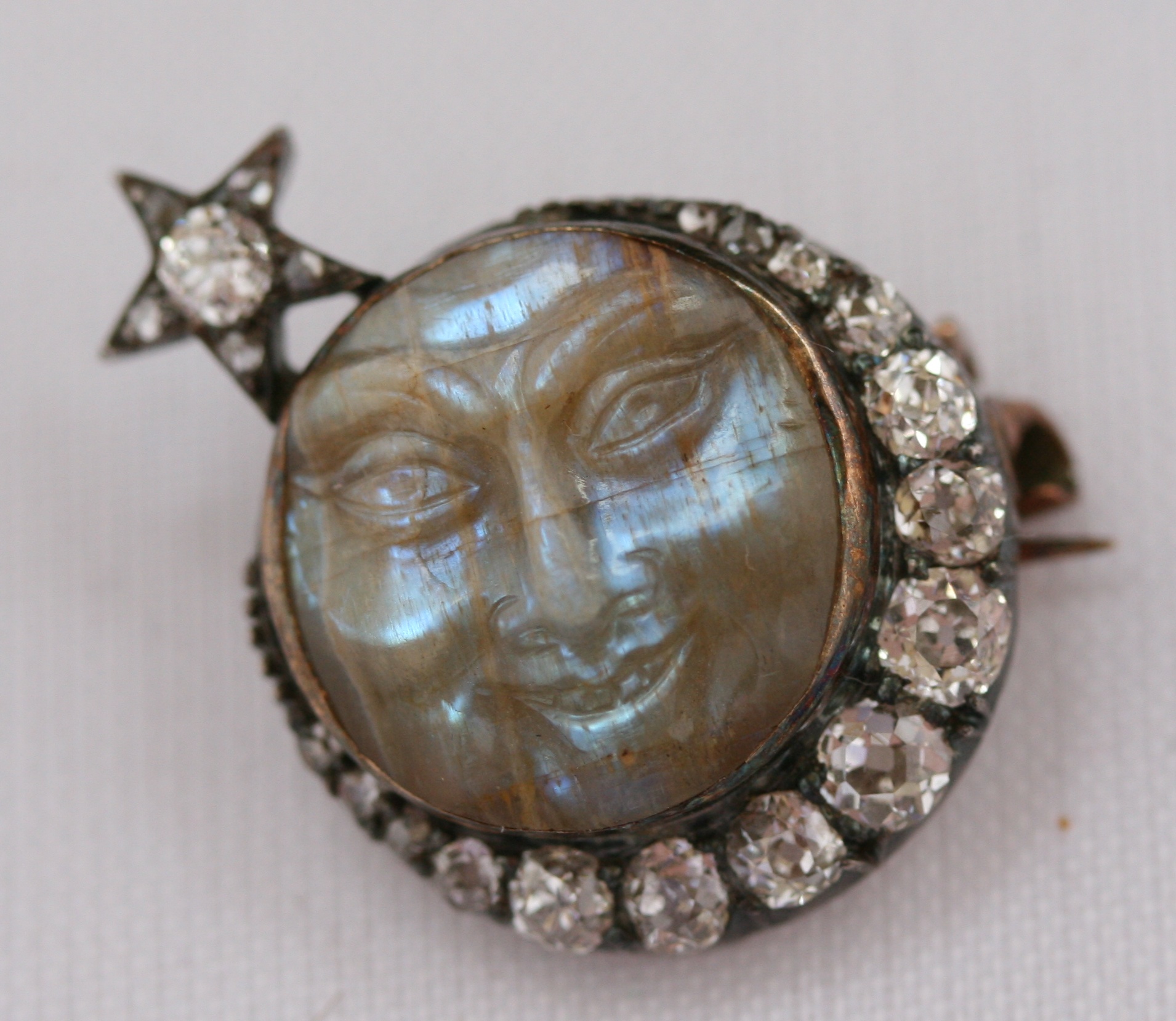 An Edwardian diamond and carved opal brooch