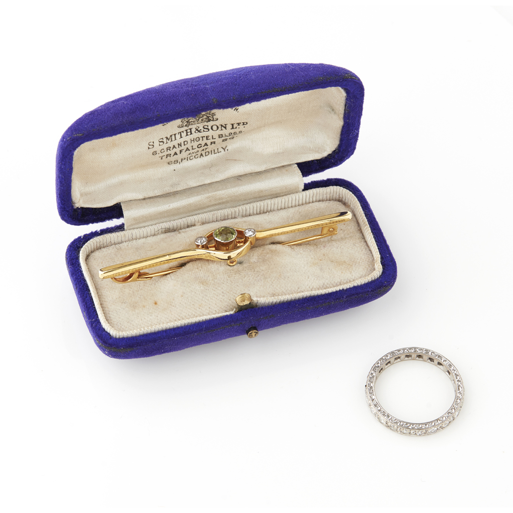 A peridot and diamond set bar brooch