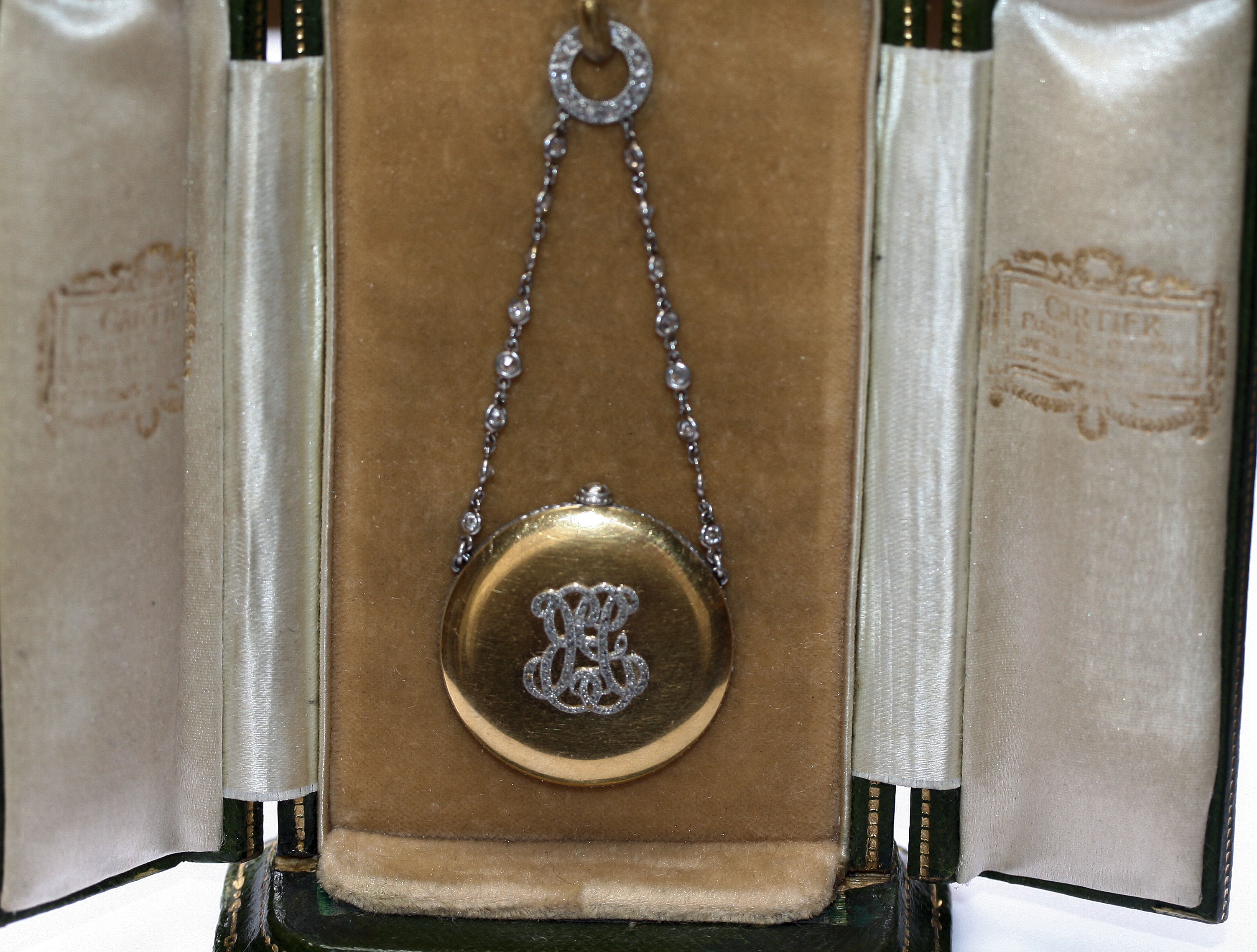 CARTIER - an early 20th century diamond set fob watch