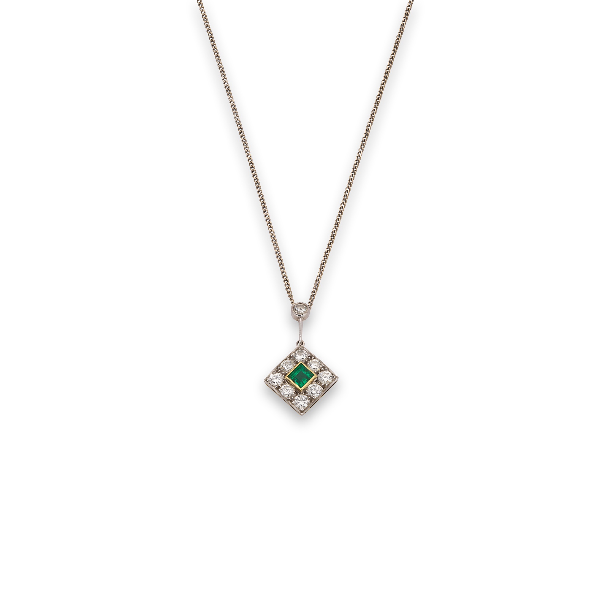 An emerald and diamond pendant