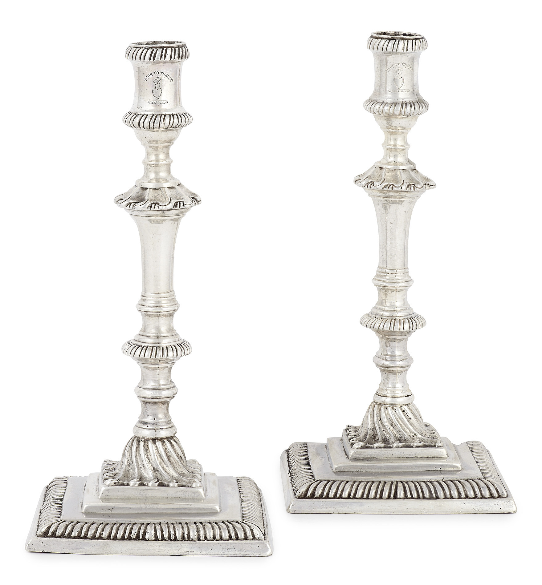 A rare pair of George III cast tapersticks