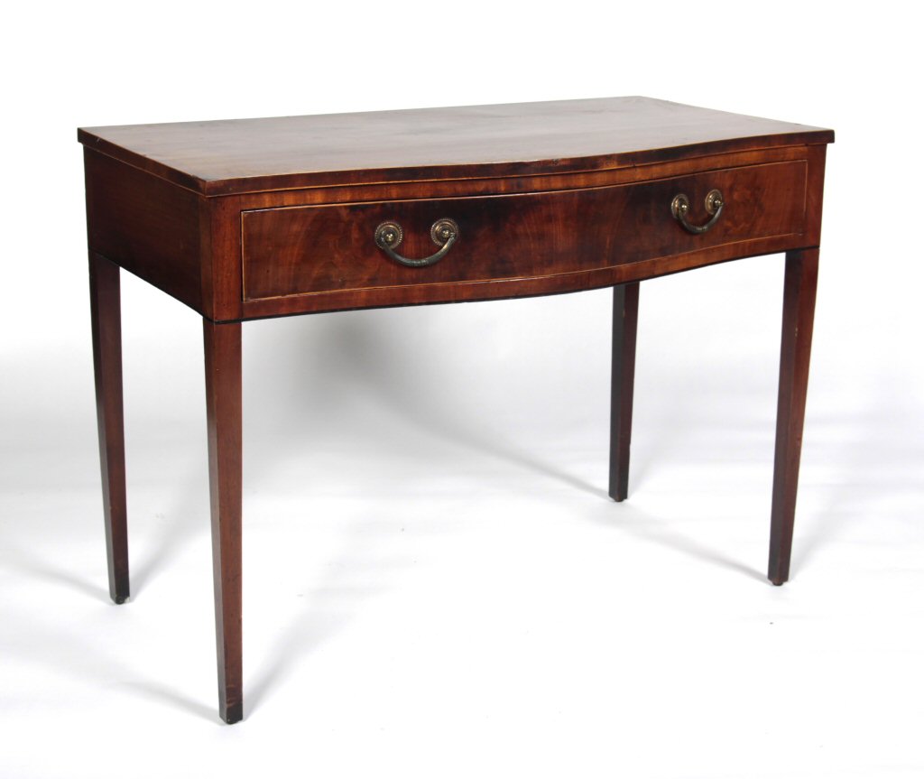 A Georgian mahogany and boxwood strung serpentine side table