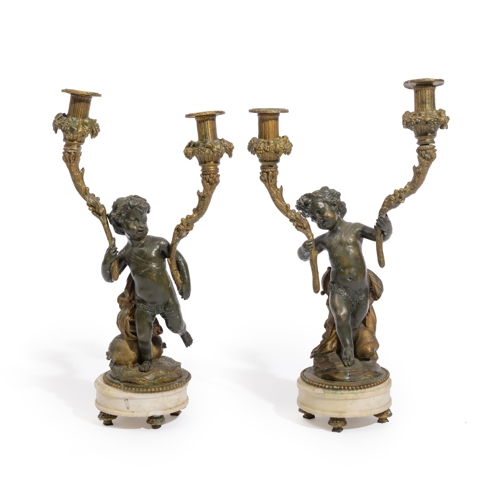 A PAIR OF FRENCH BRONZE AND GILT BRONZE TWO LIGHT CANDELABRA, IN THE MANNER OF CLODION