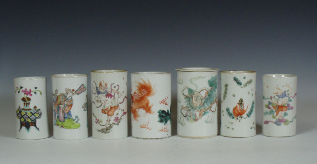 A group of seven 19th century Chinese porcelain famille rose brush pots