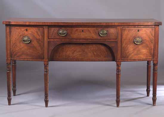 An early 19th century mahogany bow front sideboard