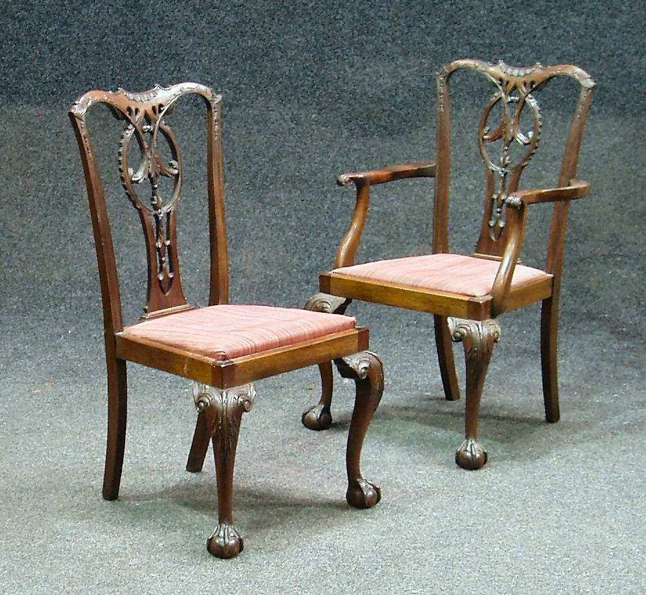 A set of eight mahogany Chippendale style chairs