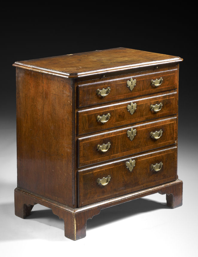 A small George I period walnut and feather-banded chest of drawers