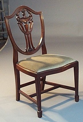 A set of eight mahogany Hepplewhite style dining chairs