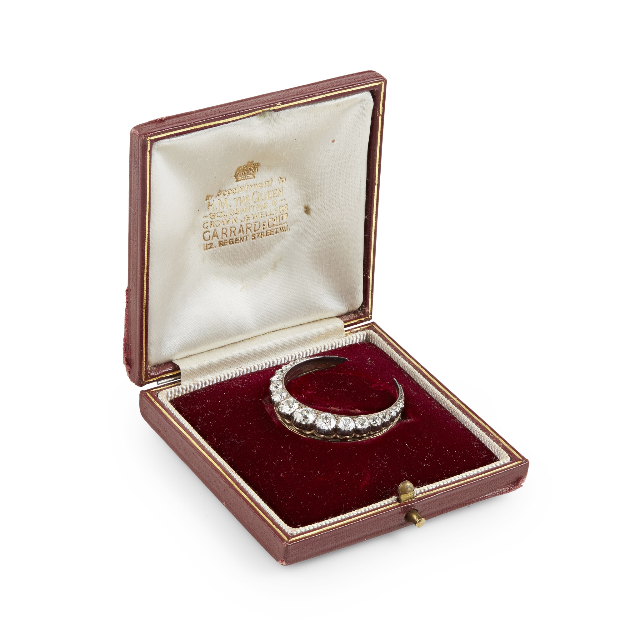 A diamond set crescent brooch