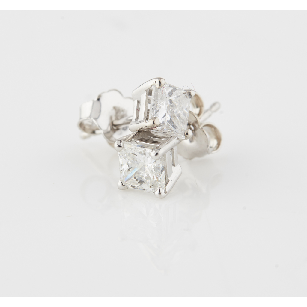 A pair of diamond set stud earrings