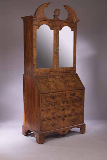 A George II style walnut bureau bookcase