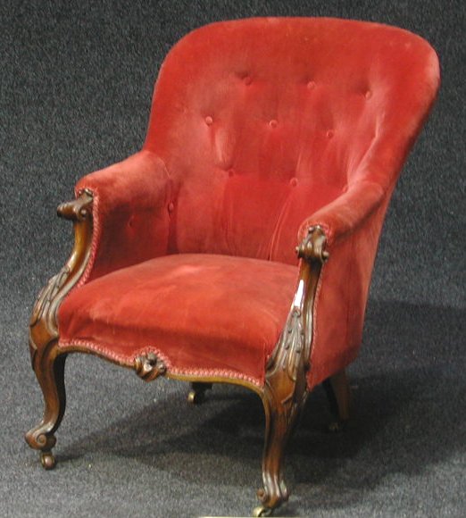 A Victorian rosewood framed button back armchair,