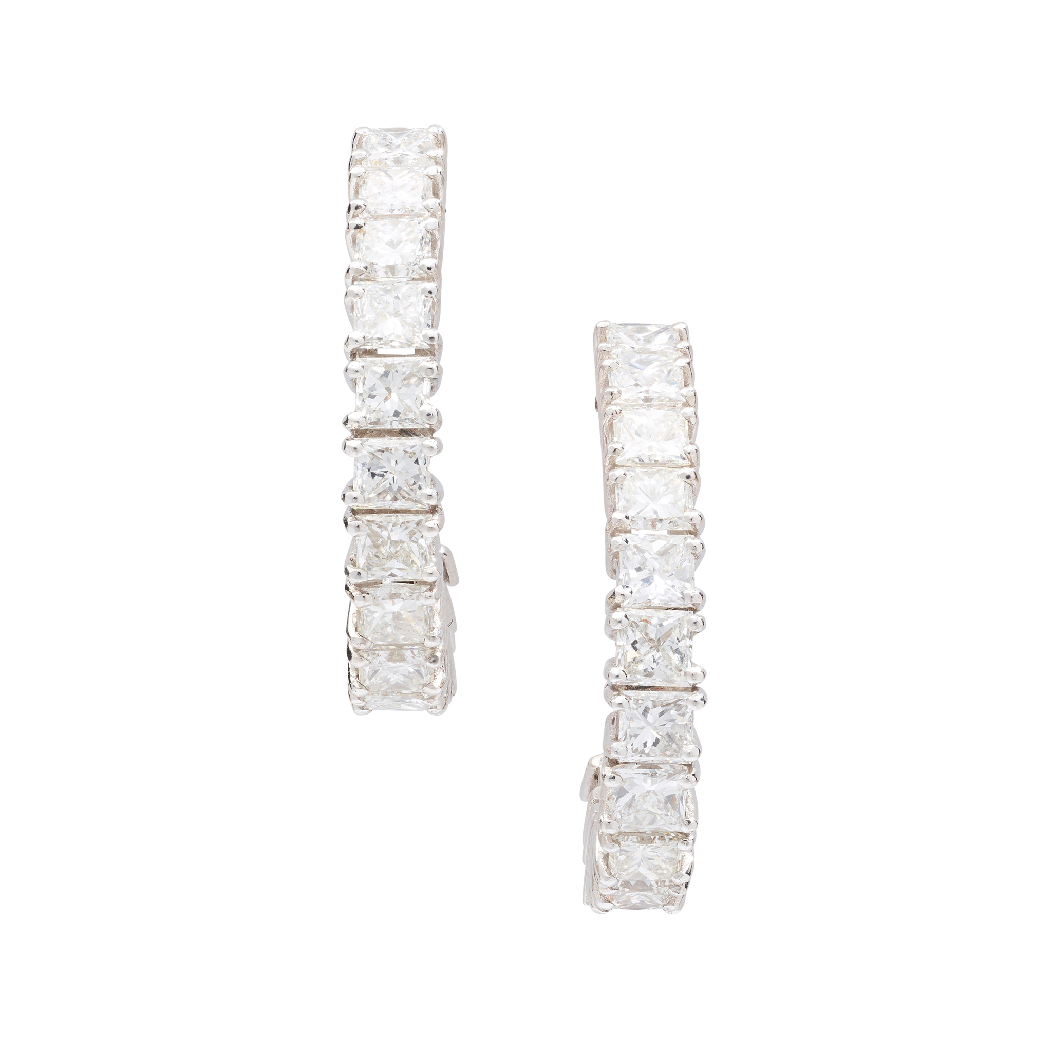 A pair of diamond half-hoop earrings