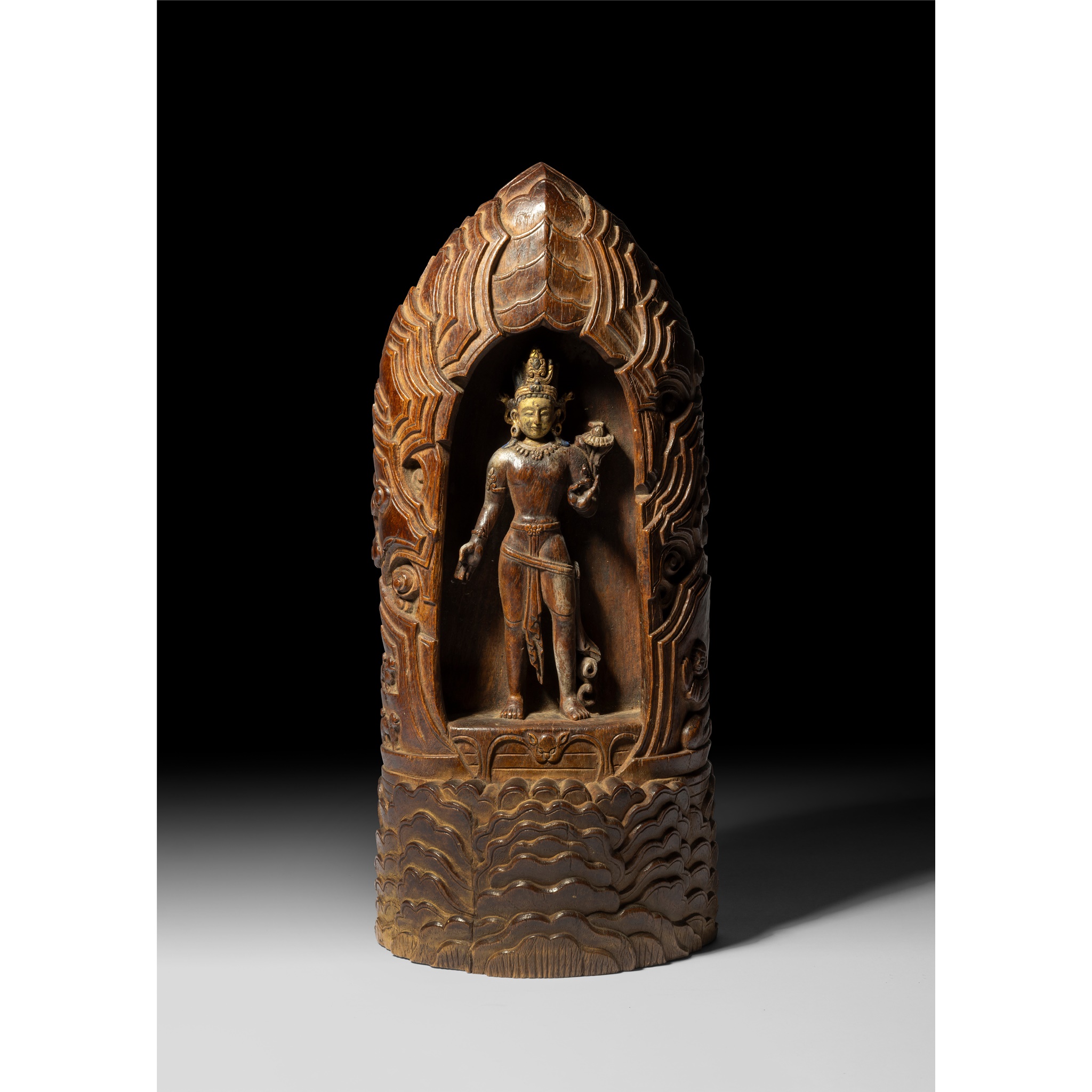 CARVED WOOD FIGURE OF PADMAPANI LOKESHVARA WITHIN A GROTTO